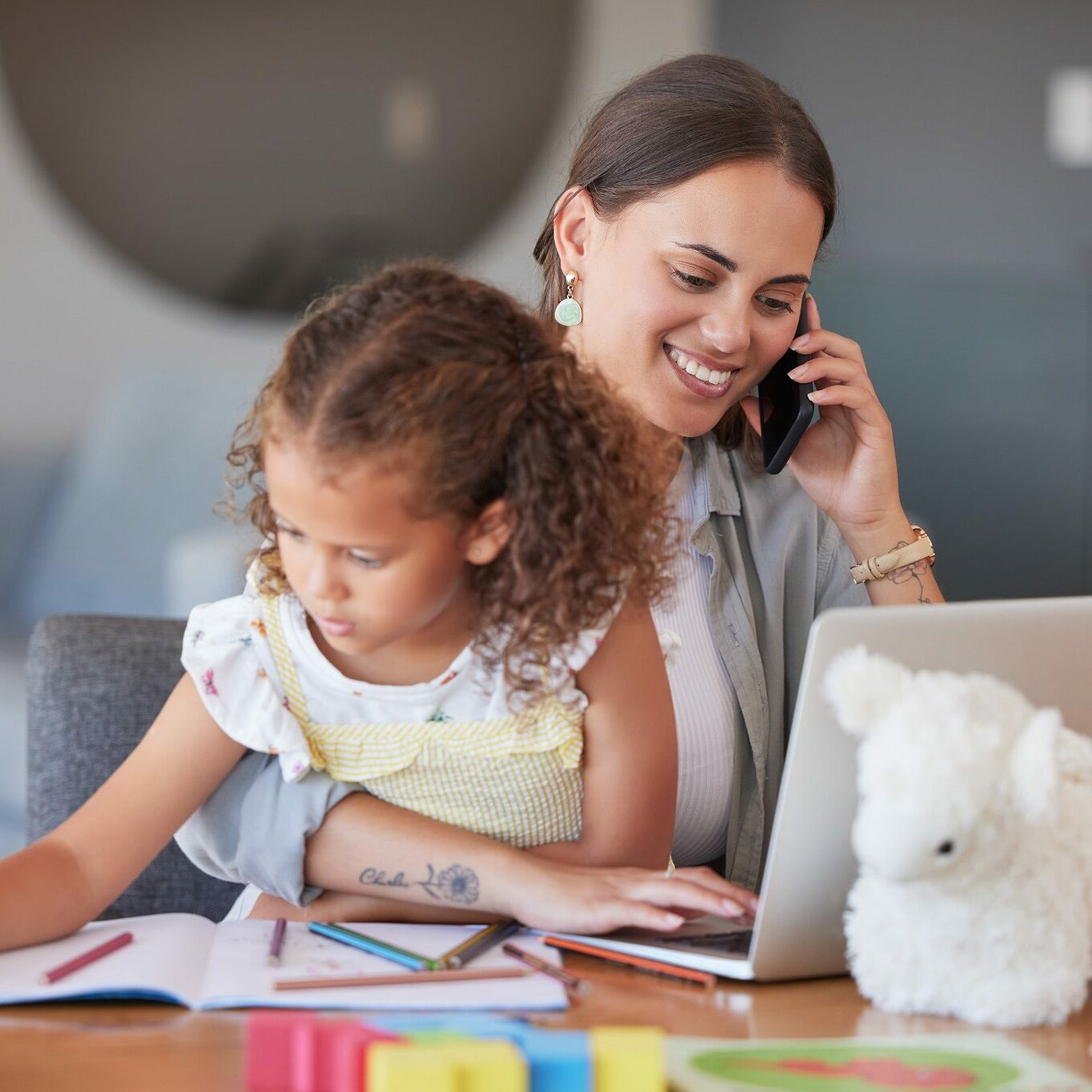 Mother, phone call and typing on laptop and working while girl play at home. Busy parent, entrepreneur or freelance worker trying to work or network on mobile technology and child drawing on paper